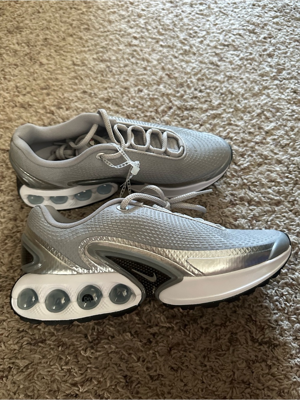Nike Gray and Silver Performance Sneakers with Visible Air Pods